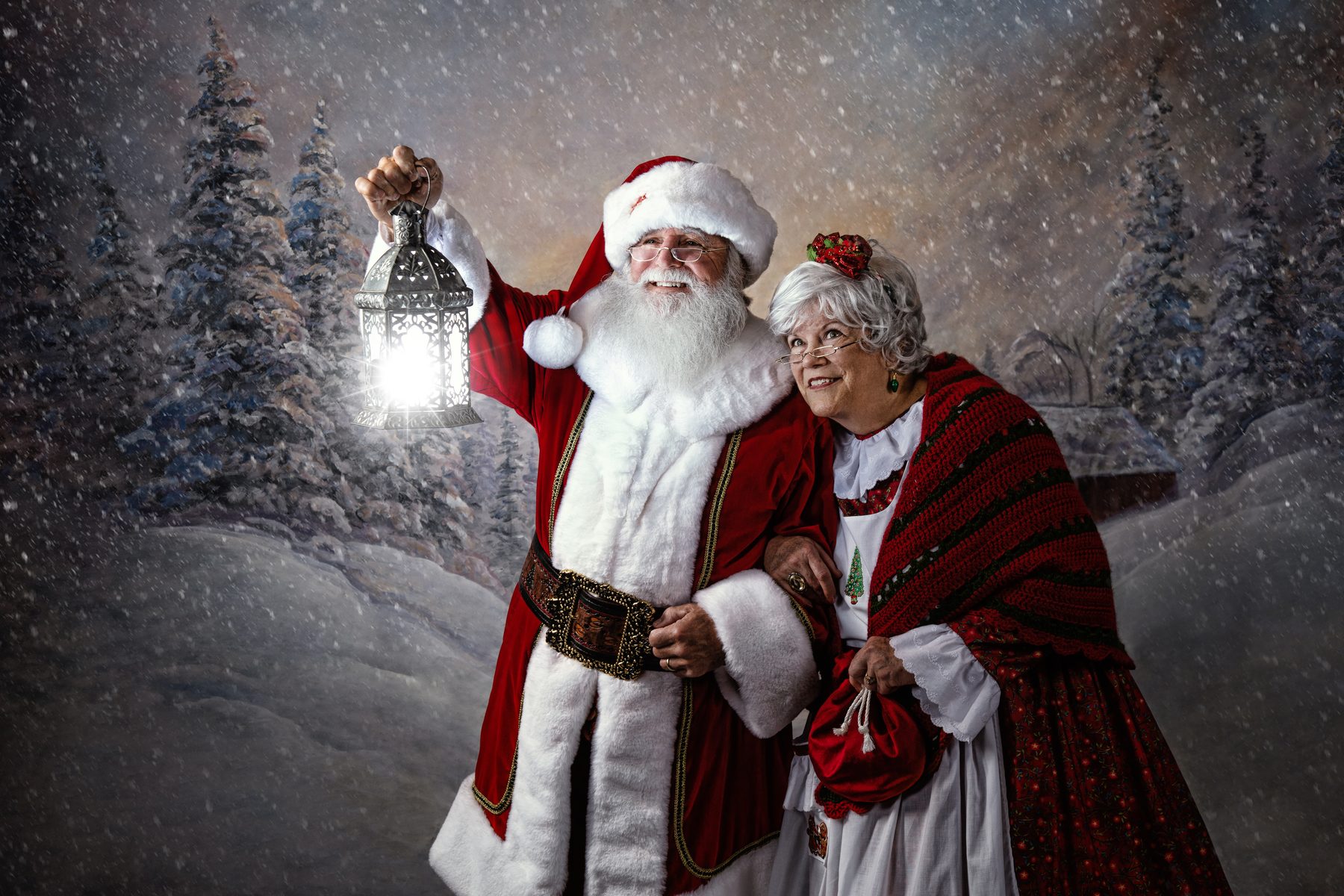 Santa Jay and Mrs. Claus in a Christmas snow portrait